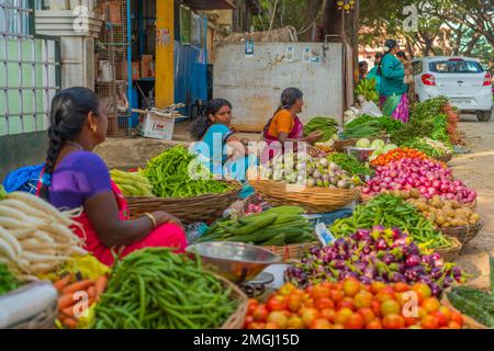 Puttaparthi, Andra Pradesh - India - January 21.2023: Womens on the local Indian vegetable market, selected focus Stock Photo