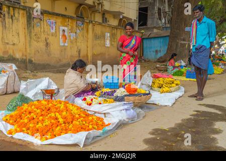 Puttaparthi, Andra Pradesh - India - January 21.2023: A women selling flowers on a local Indian market Stock Photo