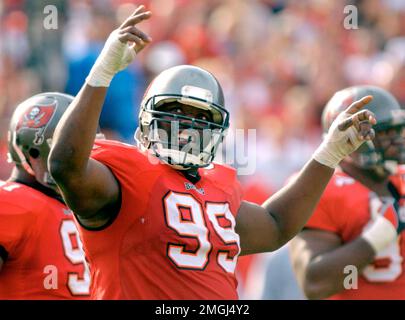 Tampa Bay Buccaneers' Warren Sapp reacts after he intercepted a pass and  pitched it to teammate Derrick Brooks who ran it in for a touchdown in the  fourth quarter of their 20-6