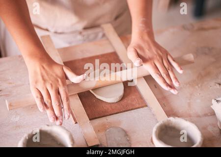 Ceramics, pottery and design with hands of woman in workshop studio for mold, creative and art. Clay, sculpture and manufacturing with girl artisan Stock Photo