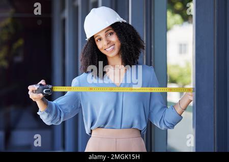 Construction worker, happy in portrait with black woman and tape measure, architecture and building industry. Measurement, architect and engineering Stock Photo