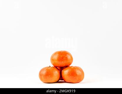 Fresh ripe tangerine or mandarin on white background isolated. Ripe tangerine full depth of field. fresh mandarin for diet raw uncooked healthy tasty Stock Photo