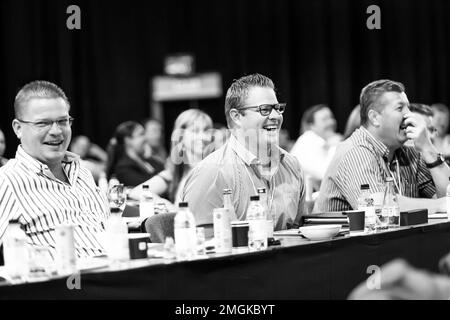 Johannesburg, South Africa - October 22, 2014: Delegates attending a sales convention in large conference hall Stock Photo