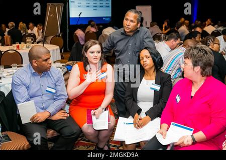 Johannesburg, South Africa - November 28, 2013: Diverse delegates attending a networking and leadership workshop Stock Photo