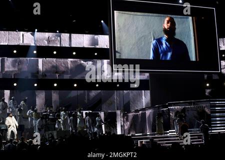 FILE - This Jan. 26, 2020 file photo shows DJ Khaled, left, performing a tribute honoring the late rapper Nipsey Hussle at the 62nd annual Grammy Awards in Los Angeles. A year after Hussle's death, his popularity and influence are as strong as ever. He won two posthumous Grammys in January, he remains a favorite of his hip-hop peers and his death has reshaped his hometown of Los Angeles in some unexpected ways. (Photo by Matt Sayles/Invision/AP, File)