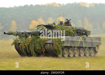 HOHENFELS, GERMANY - 25 October 2012 - A German Army Leopard II main battle tank, assigned to 104th Panzer Battalion, moves through the Joint Multinat Stock Photo