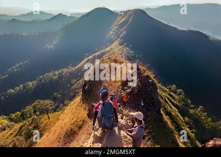 Climbing down the knife-edge ridge on Khao Chang Phueak, Thong Pha Phum National Park, Kanchanaburi, Thailand Stock Photo