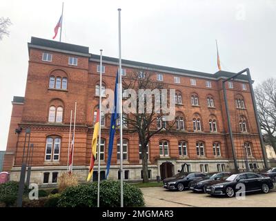 Kiel, Germany. 26th Jan, 2023. The flags in front of the state parliament of Schleswig-Holstein hang at half-mast. The day before, a 33-year-old man killed two people and injured several on a regional train from Kiel to Hamburg. Credit: Wolfgang Schmidt/dpa-Zentralbild/dpa/Alamy Live News Stock Photo