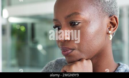 Thinking, serious and black business woman sitting in an office planning a creative project with innovative ideas in an office. Black entrepreneur Stock Photo