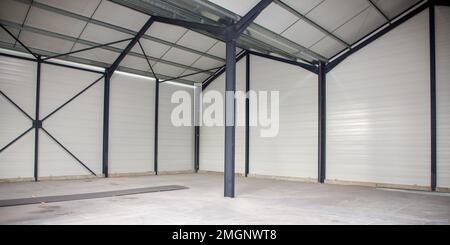 inside factory warehouse industrial building Modern interior design with concrete floor and empty space for product display or industry background Stock Photo