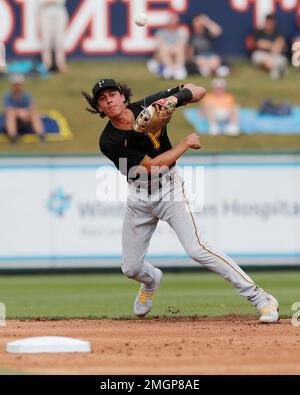 Cole Tucker of the Pittsburgh Pirates throws to first base to