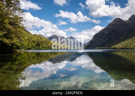 David Peaks reflected in the calm waters of Lake Gunn in the South Island of New Zealand Stock Photo