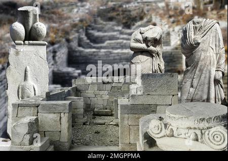 Ruins and marble statues on the island of Delos, Greece. Architecture of ancient Greece, it is one of the largest open-air museums of antiquity Stock Photo