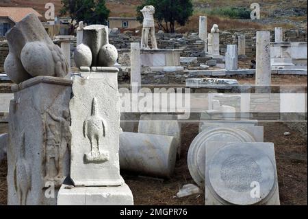 Ruins and marble statues on the island of Delos, Greece. Architecture of ancient Greece, it is one of the largest open-air museums of antiquity Stock Photo