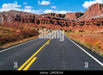 USA, Utah, black top road leading into a southwest landscape Stock Photo