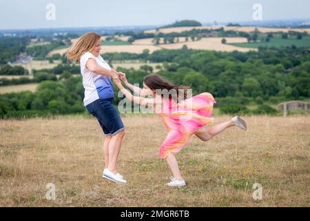Grandmother and granddaughter playing outside Stock Photo