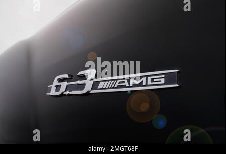 Almaty, Kazakhstan - November 20, 2021: 6.3 AMG emblem on the fender of a black Mercedes-Benz car. Lens flare. Stock Photo