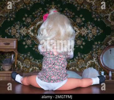 Miniature doll, made in DDR. DDR is the German acronym for Deutsche Demokratische Republik (German) or German Democratic Republic (English), a former state in Europe, 1949-1990. Stock Photo
