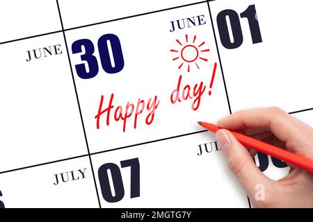 30th day of June. Hand writing the text HAPPY DAY and drawing the sun on the calendar date June 30. Save the date. Holiday. Motivation. Summer month, Stock Photo