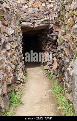 Cairn de Barnenez is a Neolithic stone mound near Plouezoc'h in Brittany, France Stock Photo