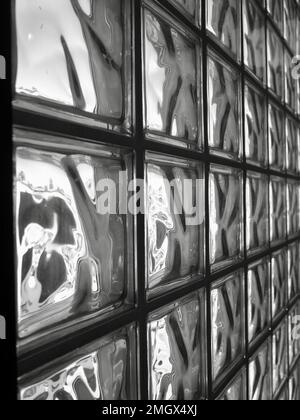 Glass wall of tiles shot in black and white from an angle.  Retro style Stock Photo