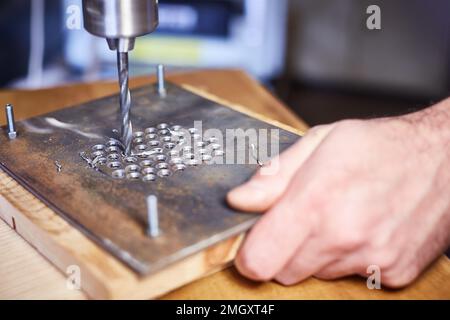 Close-up. hand heavy industrial worker is working on metal work factory process by performing mechanical Stock Photo