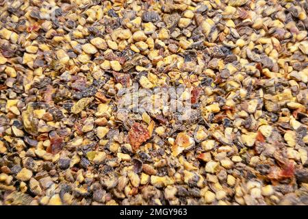 A mixture of various crushed peppers for the preparation of delicious dishes. Stock Photo