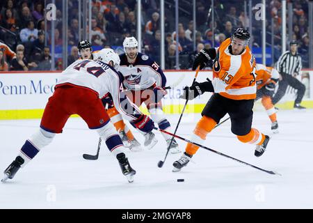 Philadelphia Flyers' Kevin Hayes, right, celebrates with Tanner Laczynski,  and Lukas Sedlak after scoring a goal during the third period of an NHL  hockey game against the New York Islanders, Tuesday, Nov.