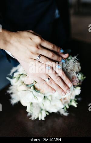 Wedding couple in love holding hands on their wedding day Stock Photo