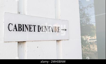 cabinet dentaire french text sign and arrow means dental clinic entrance dentist Stock Photo