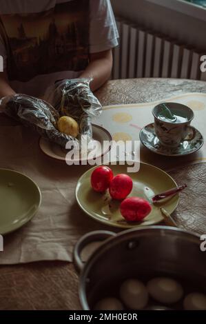 Homemade hand coloring of Easter eggs for spring holiday Stock Photo