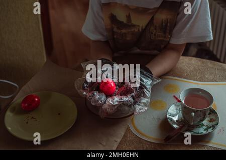 Homemade hand coloring of Easter eggs for spring holiday Stock Photo