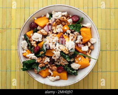 Spelt Salad with Kale, Winter Squash, Cranberries and Vegan Feta Cheese Stock Photo