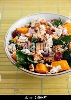 Spelt Salad with Kale, Winter Squash, Cranberries and Vegan Feta Cheese Stock Photo
