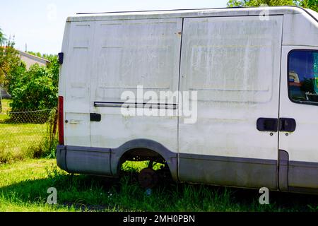 abandoned and vandalized van panel truck Stock Photo