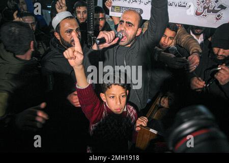 Gaza, Palestine. 26th Jan, 2023. 26 January 2023, Palestinian Territories, Gaza City: Palestinian demonstrators during a demonstration in the Jabalia camp following an Israeli strike on the Jenin refugee camp in the occupied West Bank - An Israeli raid on the Jenin refugee camp in the West Bank killed nine Palestinians, including an elderly woman, Palestinian officials said, and the army was also accused of using tear gas inside the hospital. -After the Israeli attack on Jenin camp The Palestinian National Authority announced that security coordination with the Israeli government no longer exi Stock Photo