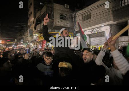 Gaza, Palestine. 26th Jan, 2023. 26 January 2023, Palestinian Territories, Gaza City: Palestinian demonstrators during a demonstration in the Jabalia camp following an Israeli strike on the Jenin refugee camp in the occupied West Bank - An Israeli raid on the Jenin refugee camp in the West Bank killed nine Palestinians, including an elderly woman, Palestinian officials said, and the army was also accused of using tear gas inside the hospital. -After the Israeli attack on Jenin camp The Palestinian National Authority announced that security coordination with the Israeli government no longer exi Stock Photo