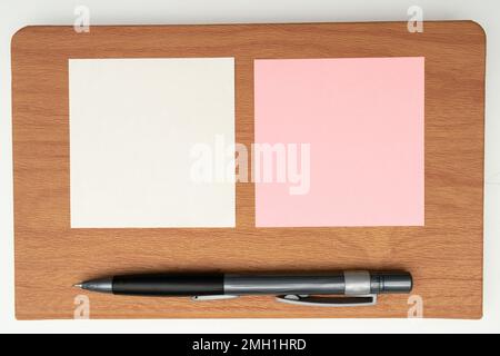 Important Message Written On Piece OF Paper. Photo Of Different Office Supplies, Stickers, Notebooks, Pens, Pencils, Rullers, Marckers, Stapler Stock Photo