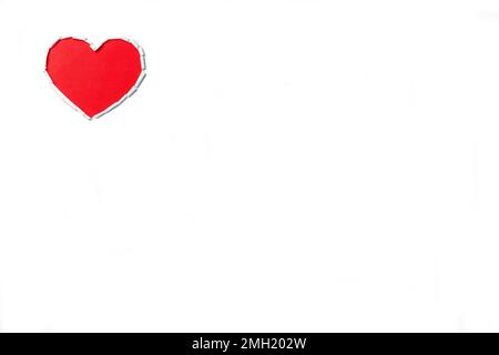 Red heart torn on white paper. Postcard for St. Valentine's Day Stock Photo