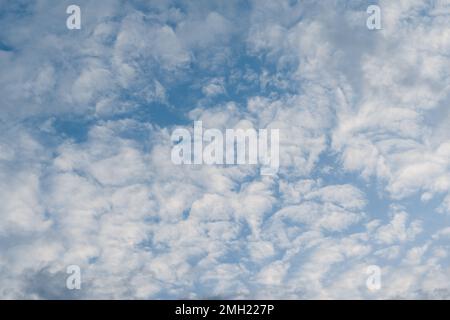 Blue sky with white fluffy cloud using as nature wallpaper or background. Stock Photo