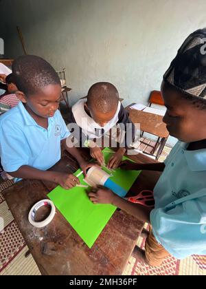 children's art and crafts for charity .kids activity for poor people in zanzibar, Tanzania. Stock Photo