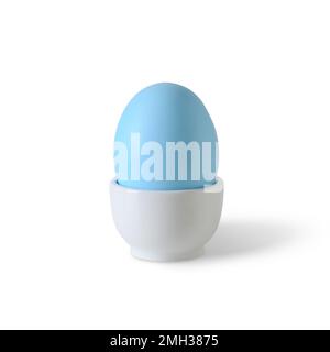 Easter one blue egg isolated in white porcelain stand on white background. Stock Photo