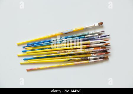 brushes in watercolor paint on an isolated background closeup ,hobby and creativity artist Stock Photo