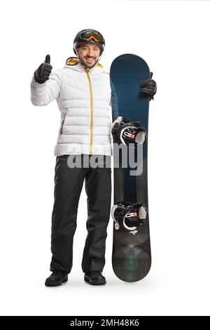 Full length portrait of a man with a snowboard and suitcases waiting ...