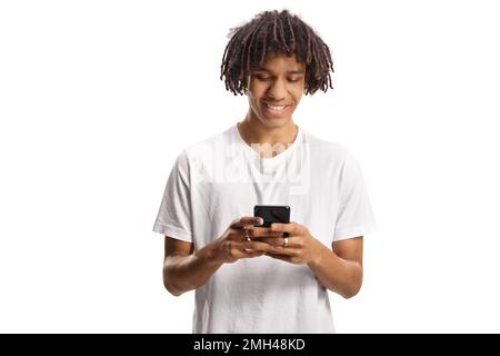 Afro american young man using a smartphone and smiling isolated on white background Stock Photo