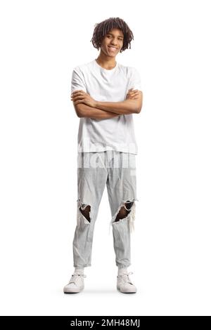 Full length portrait of a young afro american man with dreadlocks standing and smiling isolated on white background Stock Photo