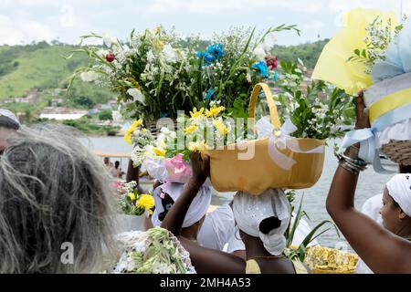 Cachoeira, Bahia, Brazil - February 21, 2016: Women carrying gifts for the feast of Iemanja in the city of Cachoeira, Bahia. Stock Photo
