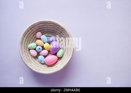 easter concept with multi color egg on pink background. Stock Photo