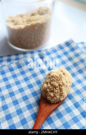 coconut sugar in a white bowl on table  Stock Photo