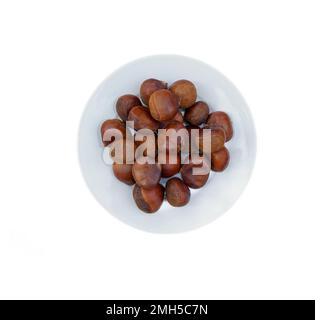 On white plate, Chinese chestnuts sold in the US. There are photo and vector versions for design idea. Chinese chestnuts are bigger size than others Stock Photo